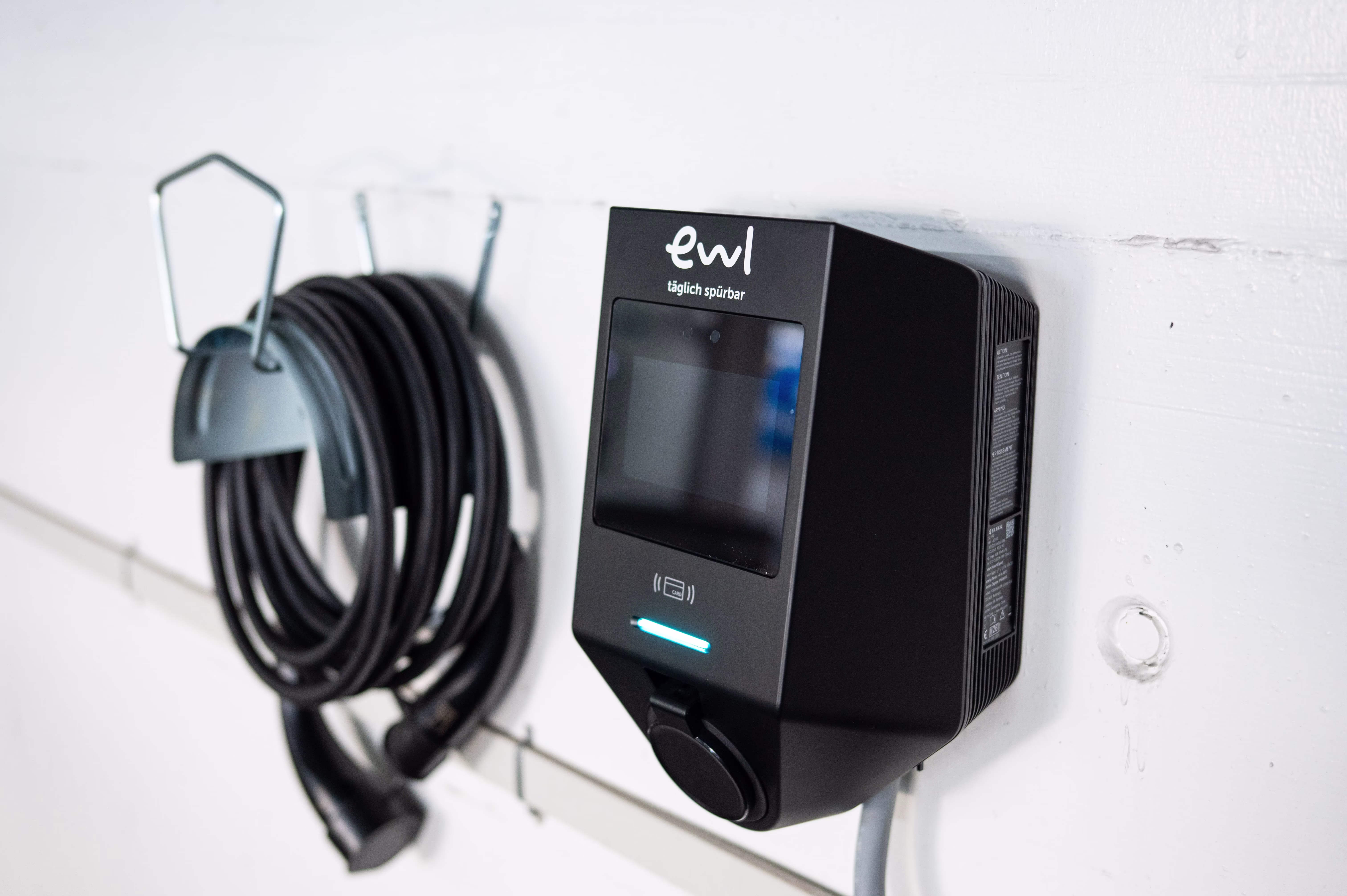 Elecq charging station mounted on a wall